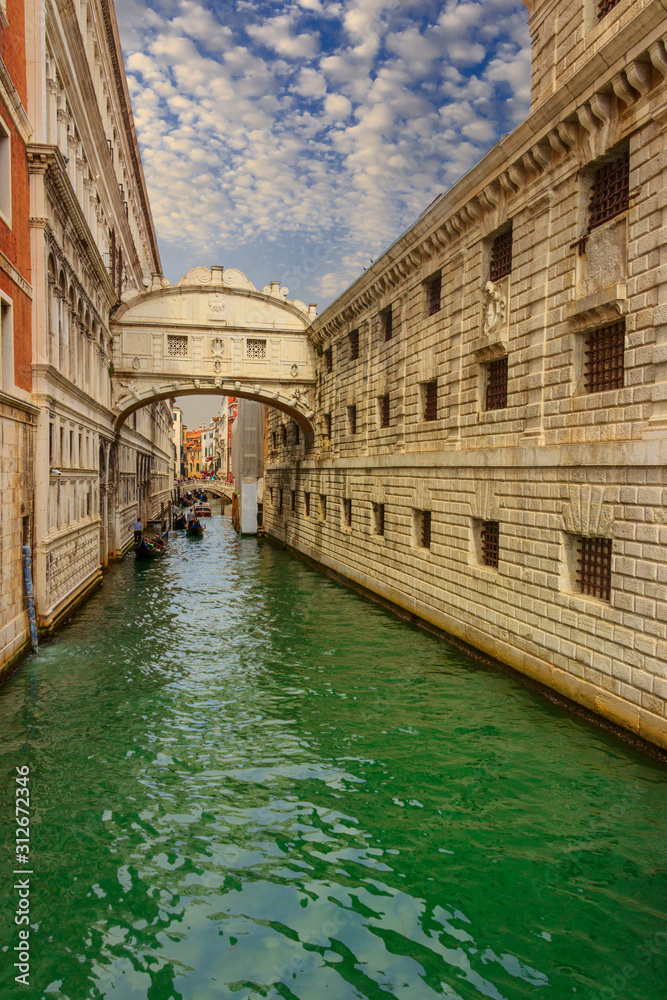 Venice. The Bridge of Sighs (Ponte dei Sospiri). The enclosed bridge is made of white limestone, has windows with stone bars, passes over the Rio di Palazzo, connects the New Prison to Doge's Palace.