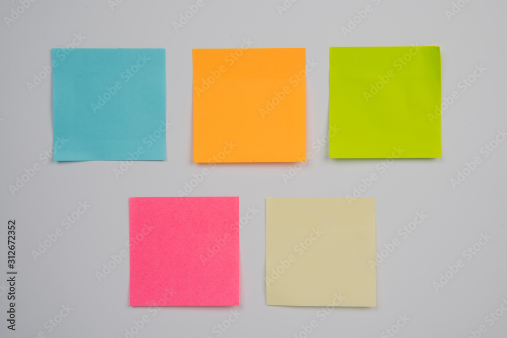 colorful sticky notes on white wall 