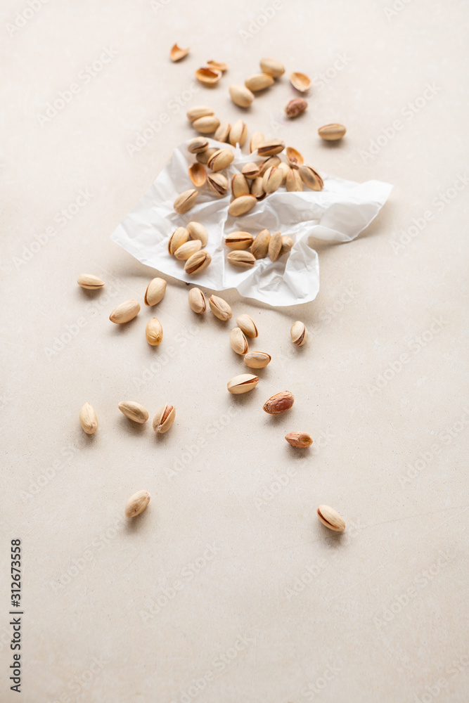 Pistachio nuts on stone background Pistachio nuts on stone background