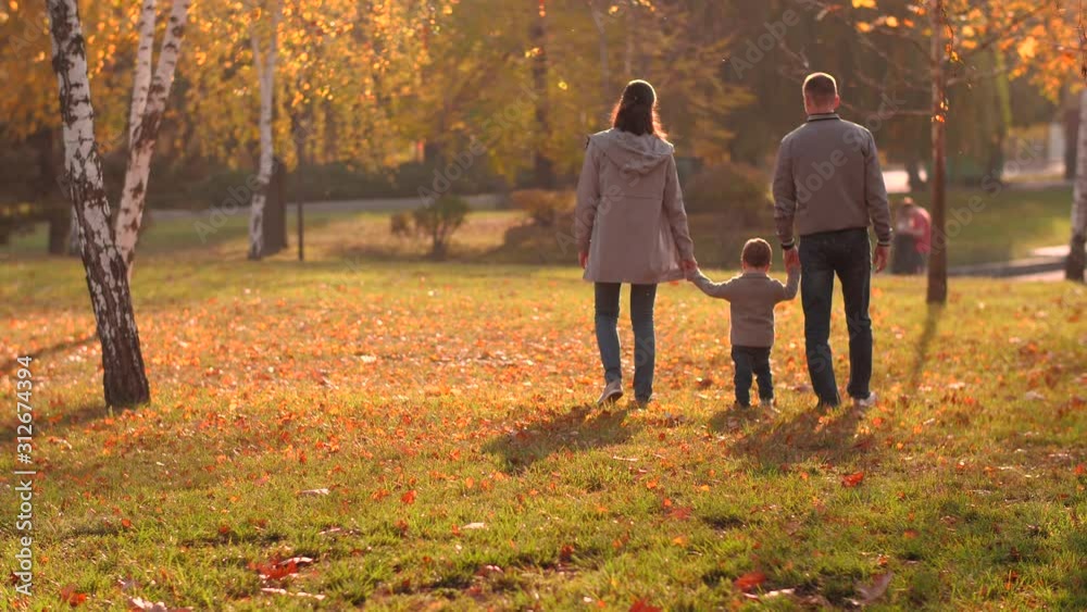 Happy family walking at park Happy family walking at park