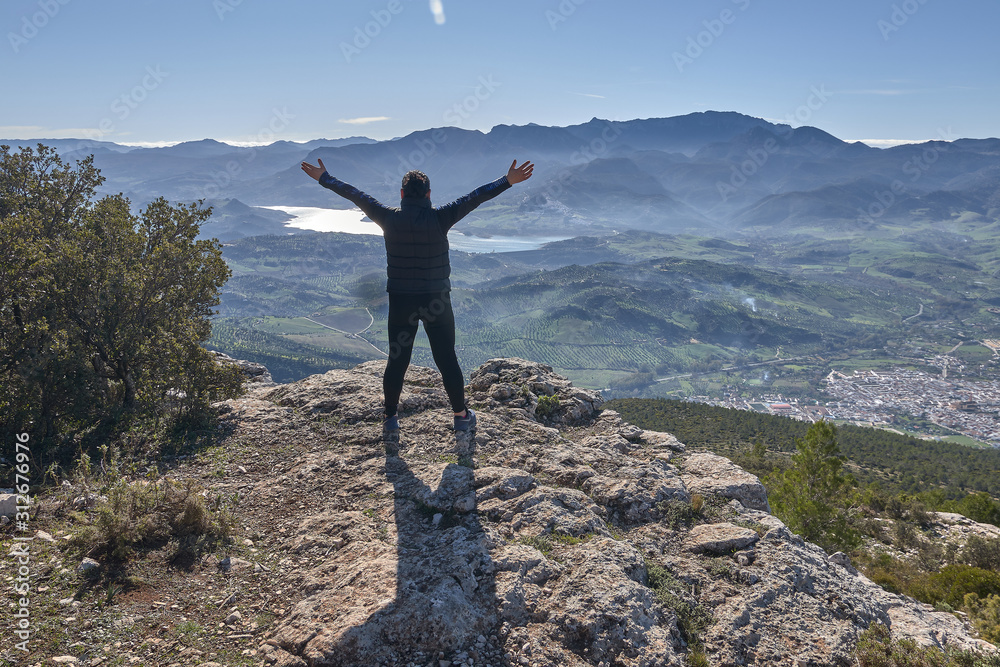 woman loving nature and sun in the mountain open arms woman loving nature and sun in the mountain open arms