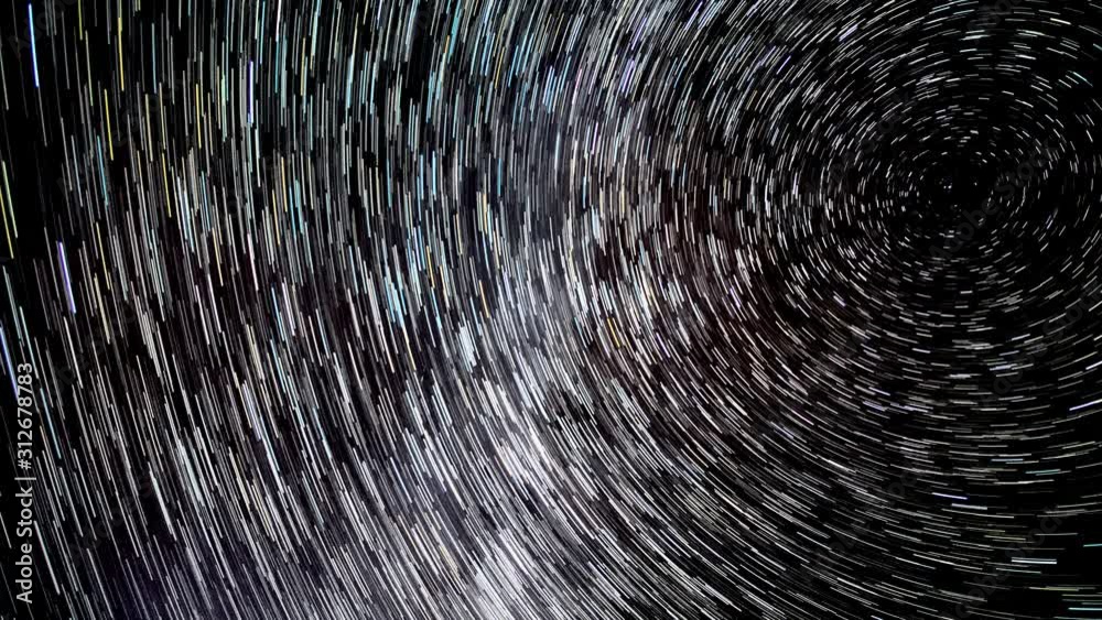 Time lapse of Star trails in the night sky. Stars move around a polar ...