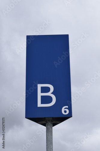 Blue Metal Parking Sign with White Lettering & Large Letter B 