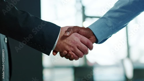Close up hands business people shaking successful corporate partnership deal welcoming opportunity in office agreement professional greeting meeting colleagues partners slow motion photo