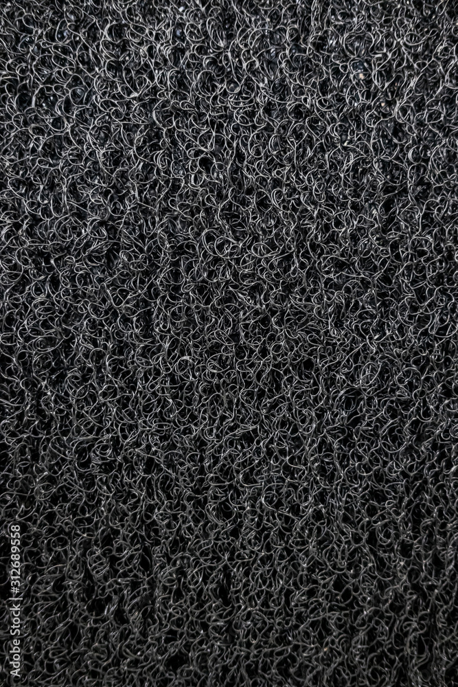 Fototapeta premium Background of black coil car floor mat texture