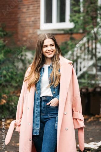 Happy young millenial woman outdoor in Westmount, Montreal