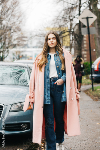 Portrait of young millenial woman in the city photo