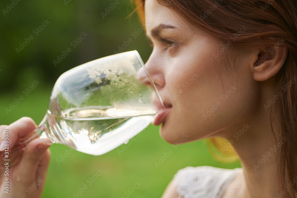 woman drinking a glass of water woman drinking a glass of water