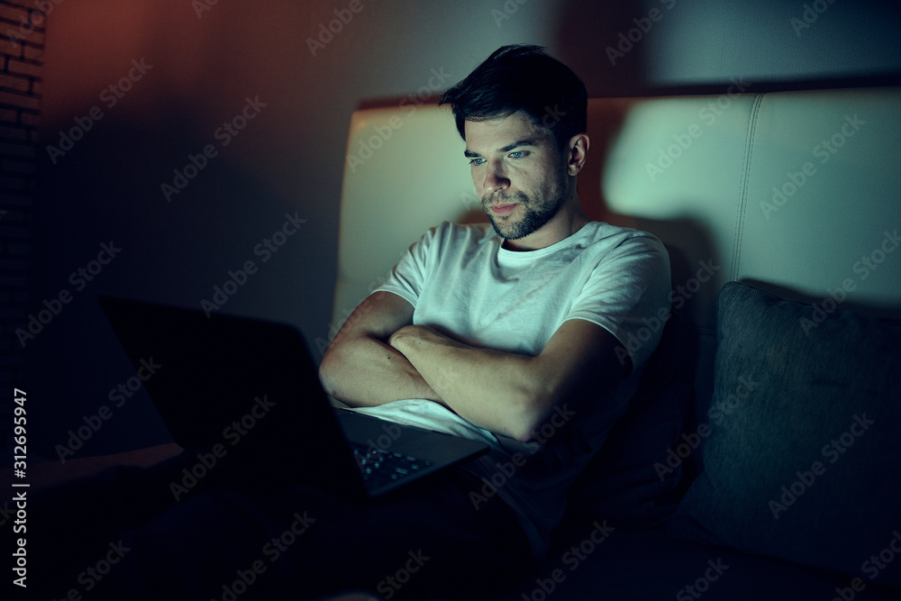 young man sitting on sofa young man sitting on sofa