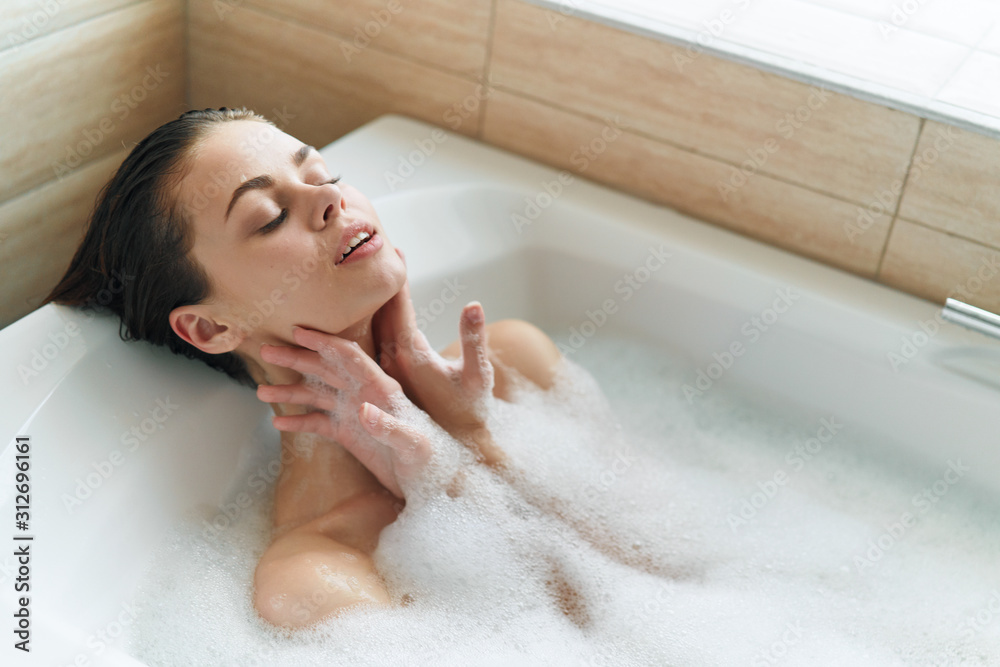 woman relaxing in bubble bath woman relaxing in bubble bath