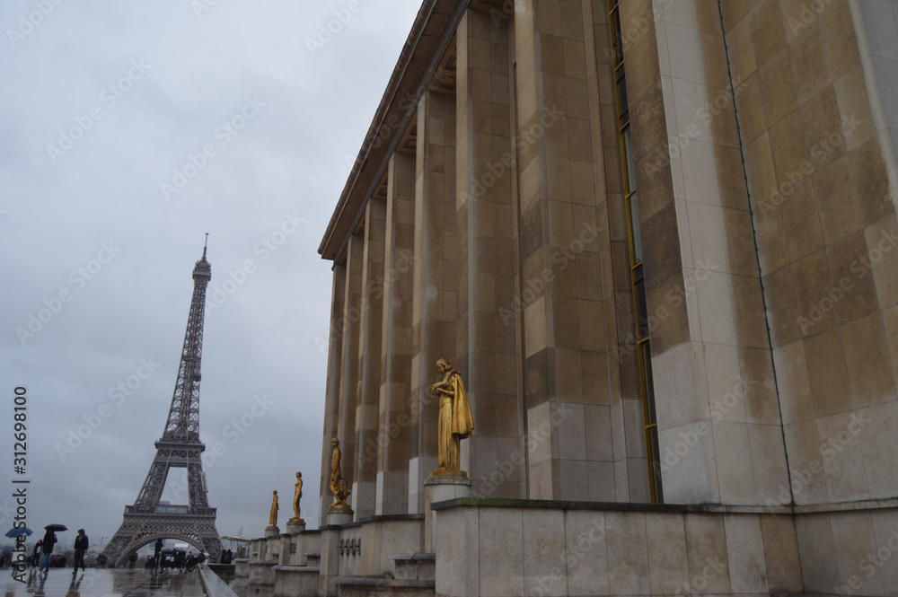 View of majestic Eiffel tower from Trocadero on a cloudy day in Paris France