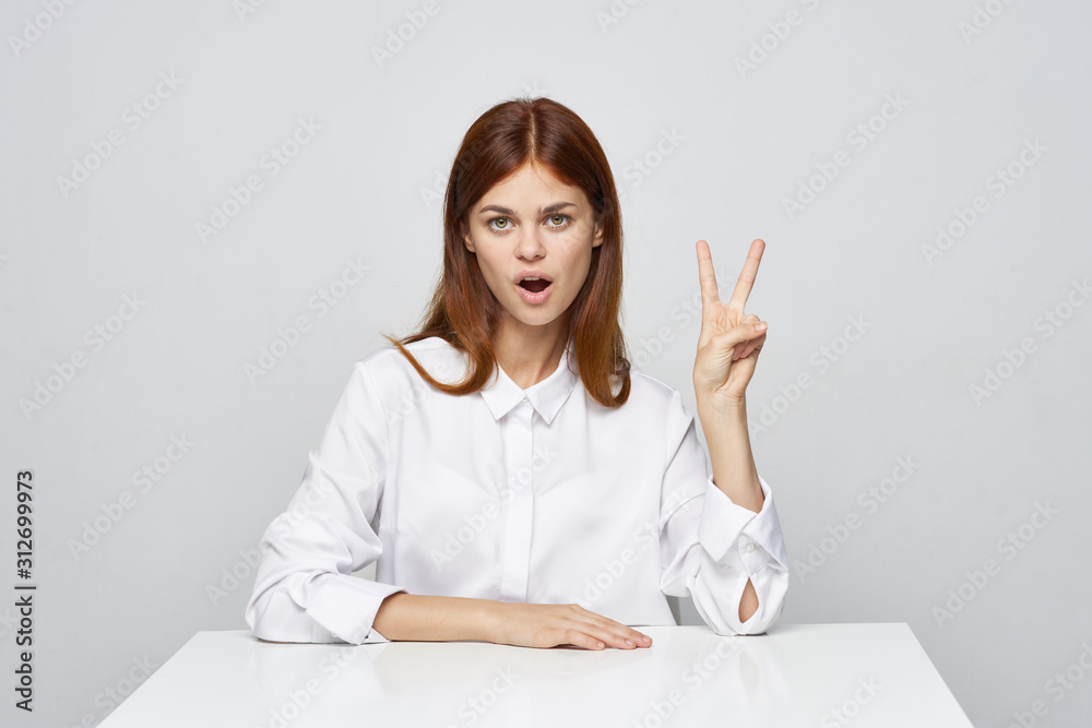 smiling young woman with thumbs up smiling young woman with thumbs up