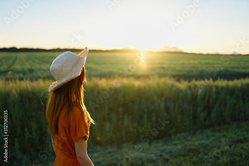 woman in hat on a field