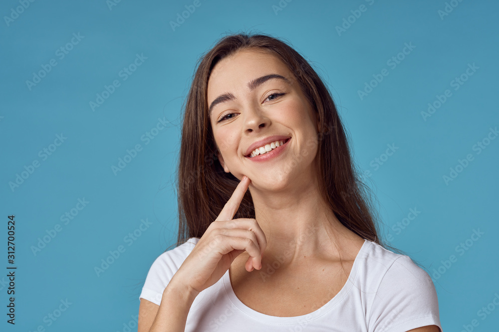 young woman with finger on her lips young woman with finger on her lips