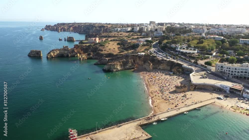 Aerial view of people sun baking on crowded beach in Lagos, Portugal Aerial view of people sun baking on crowded beach in Lagos, Portugal