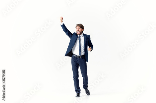 happy young businessman with his arms up