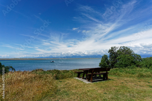 A picnic table and chairs at Motueka seafront, Tasman region, New Zealand. © Gary