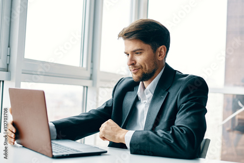businessman sitting at desk in office