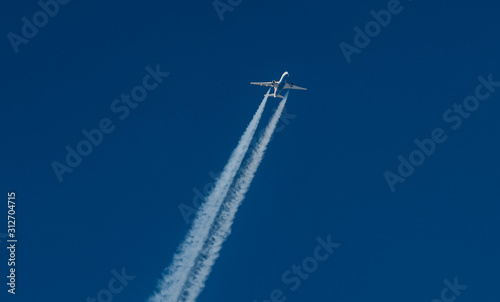 aerial view of a jet creating a contrail