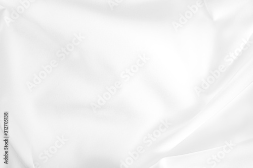 Abstract white fabric texture background. Cloth soft wave. Creases of satin, silk, and cotton. 
