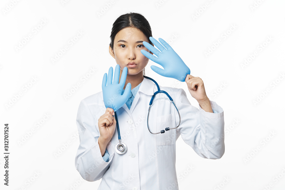 Fototapeta premium young doctor with stethoscope isolated on white