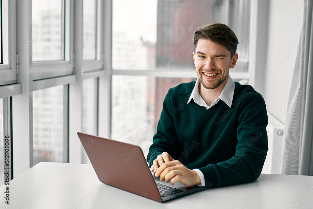 man working on laptop at home