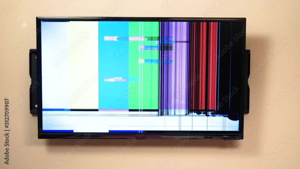 Flat screen television with without reception and a cracked screen. No image is displaying, the TV is broken. Flat screen television with without reception and a cracked screen. No image is displaying, the TV is broken.