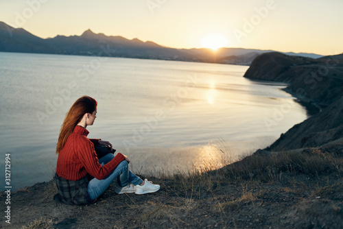 woman sitting on the beach