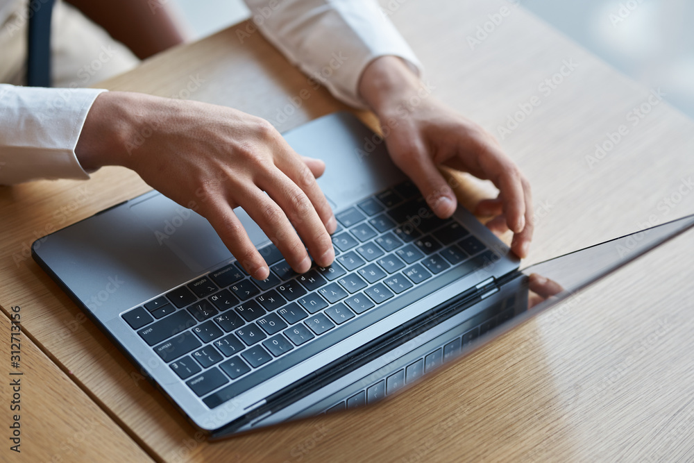 hands typing on laptop hands typing on laptop