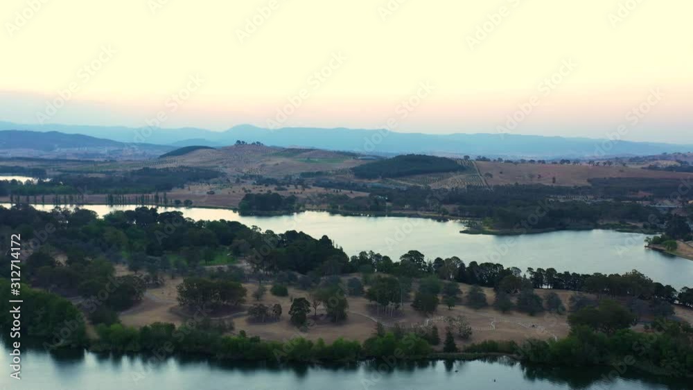 Aerial panoramic view of Lake Burley Griffin traveling above Kurrajong Point looking toward the arboretum in Canberra, Australia Aerial panoramic view of Lake Burley Griffin traveling above Kurrajong Point looking toward the arboretum in Canberra, Australia