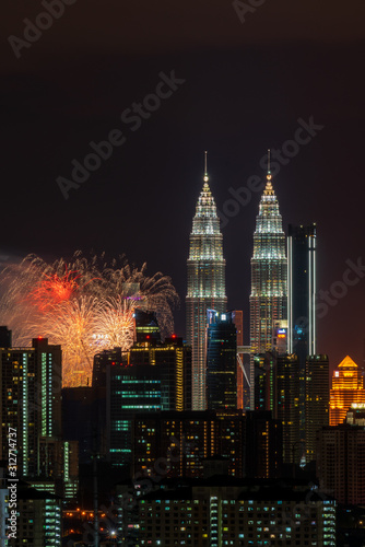 KUALA LUMPUR  MALAYSIA - 1ST JANUARY 2020  Fireworks explode near Malaysia s landmark Petronas Twin Towers during New Year celebrations in Kuala Lumpur.