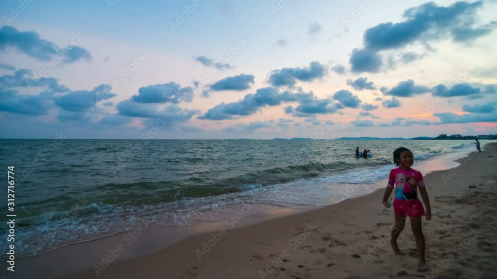RAYONG ,THAILAND -April 6 ,2019 : day to night time lapse of Nam Rin Beach with sunset at Rayong, Thailand RAYONG ,THAILAND -April 6 ,2019 : day to night time lapse of Nam Rin Beach with sunset at Rayong, Thailand