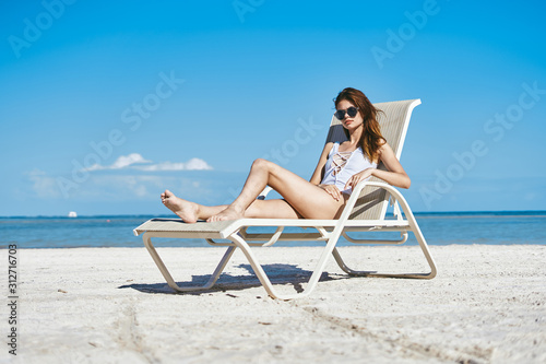 woman in bikini on beach © SHOTPRIME STUDIO
