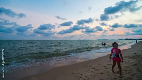 RAYONG ,THAILAND -April 6 ,2019 : day to night time lapse of Nam Rin Beach with sunset at Rayong, Thailand