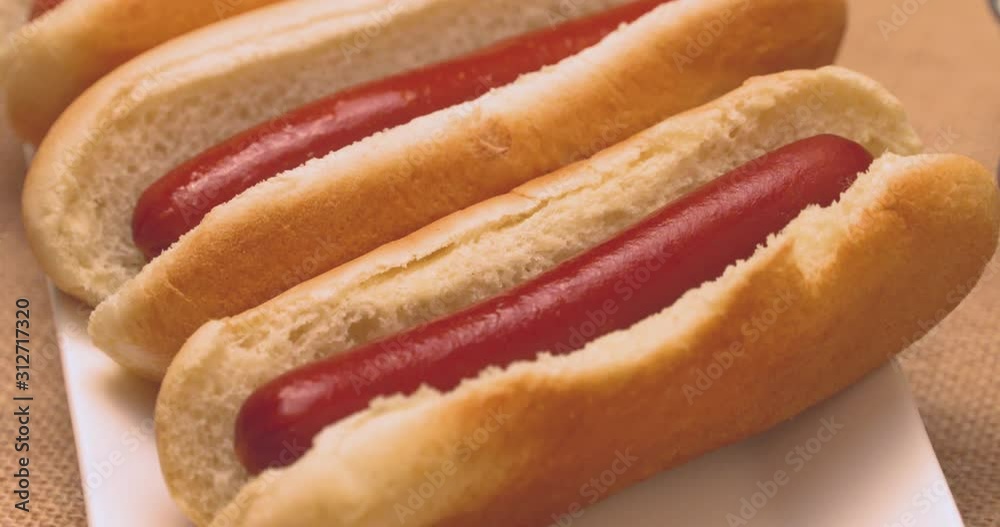 Delicious hot dogs with a selection of condiments on the side. Delicious hot dogs with a selection of condiments on the side.