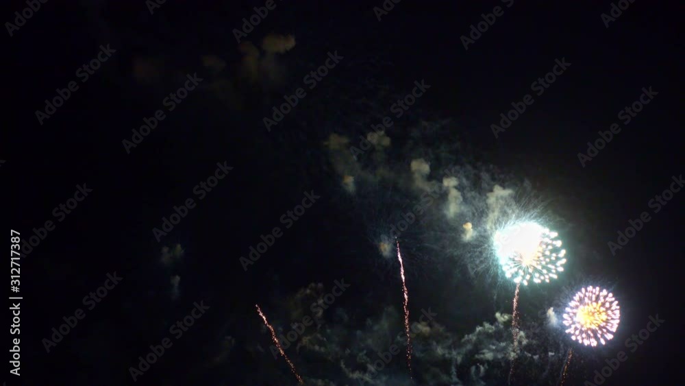 Beautiful abstract colourful Fireworks explode display on sky at night a symbol of celebration in New years anniversary for background