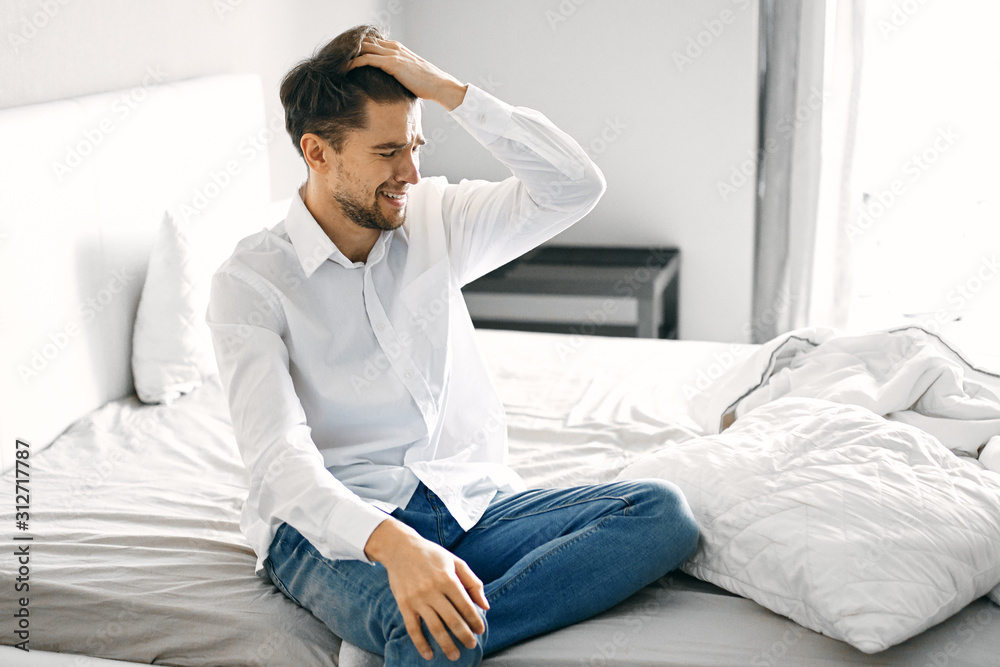 portrait of a man sitting on sofa portrait of a man sitting on sofa