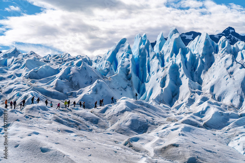 Tourists Trekking on Perito Moreno Glacier Near El Calafate, Patagonia, Argentina, South America photo
