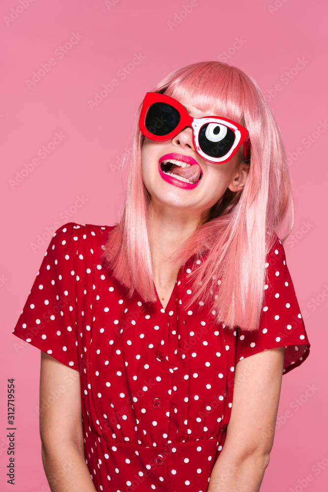 Fototapeta premium portrait of a girl in pink glasses