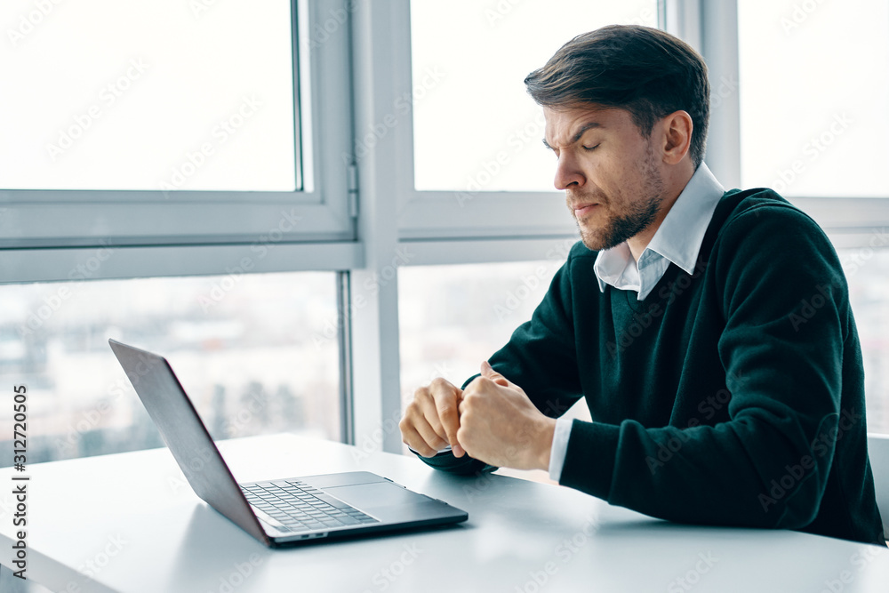 businessman working on laptop in office businessman working on laptop in office