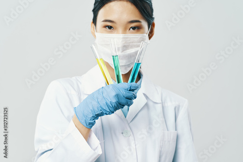 doctor in mask with syringe isolated on white