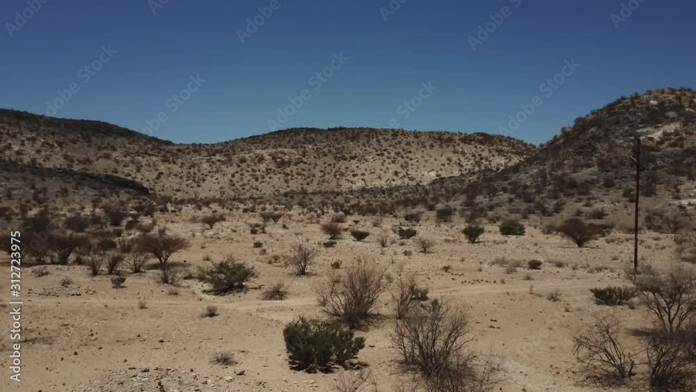 4K aerial drone video of gravel plains and Erongo Mountains near town Usakos, B1 highway to west coast of Namibia and dry waterless hot bushy savanna in Karibib District, central Namibia 4K aerial drone video of gravel plains and Erongo Mountains near town Usakos, B1 highway to west coast of Namibia and dry waterless hot bushy savanna in Karibib District, central Namibia