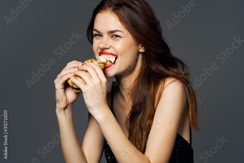 portrait of young woman eating cake