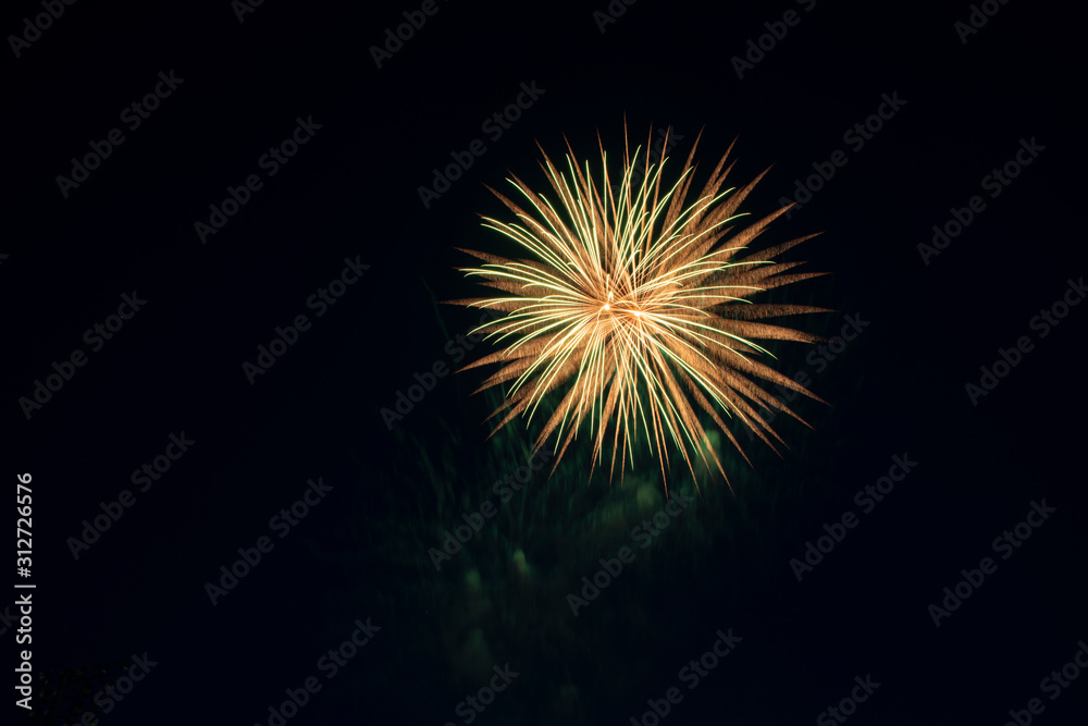 Yellow and orange fireworks at New Year celebration