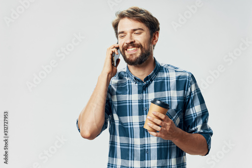 young man talking on the phone isolated on white © SHOTPRIME STUDIO