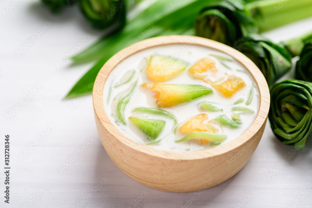 Thai dessert (Lod Chong), rice flour pandan flavor and sliced melon fruit in coconut milk Thai dessert (Lod Chong), rice flour pandan flavor and sliced melon fruit in coconut milk