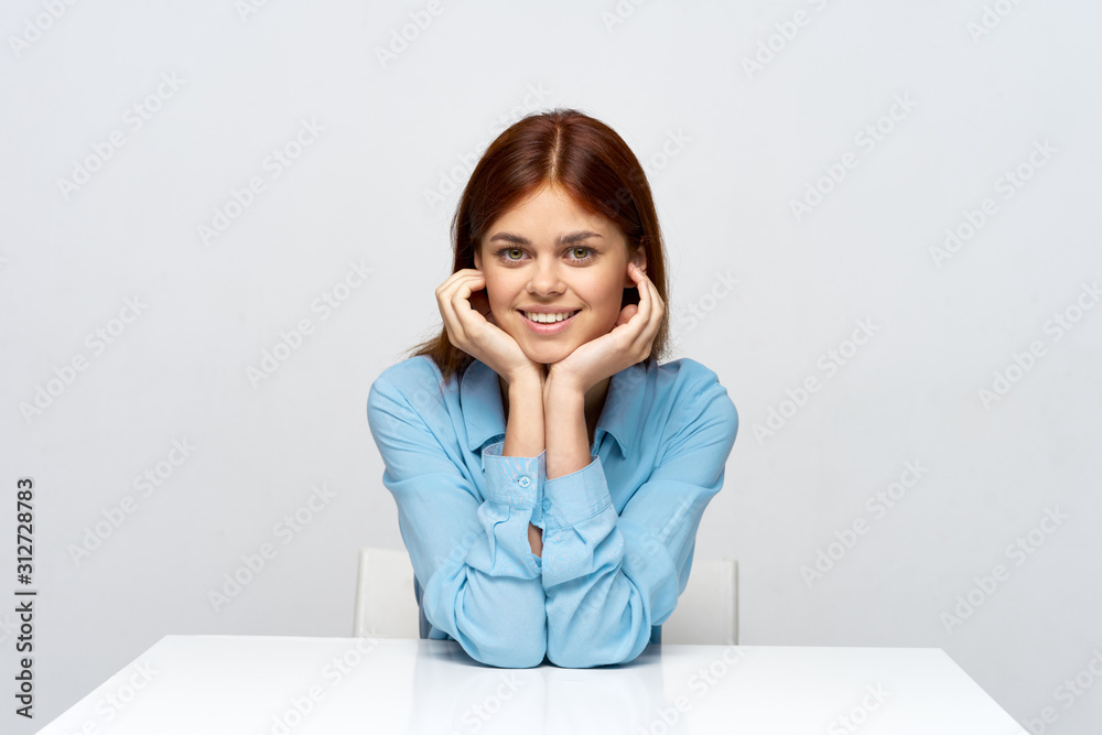 young woman sitting at desk with laptop young woman sitting at desk with laptop