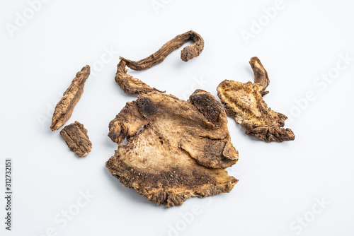 Chinese herbal medicine Duhuo closeup on white background