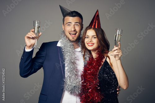 young couple in party hats