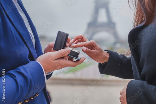 marriage proposal in Paris, wedding in France, hands of romantic couple with engagement ring © Song_about_summer
